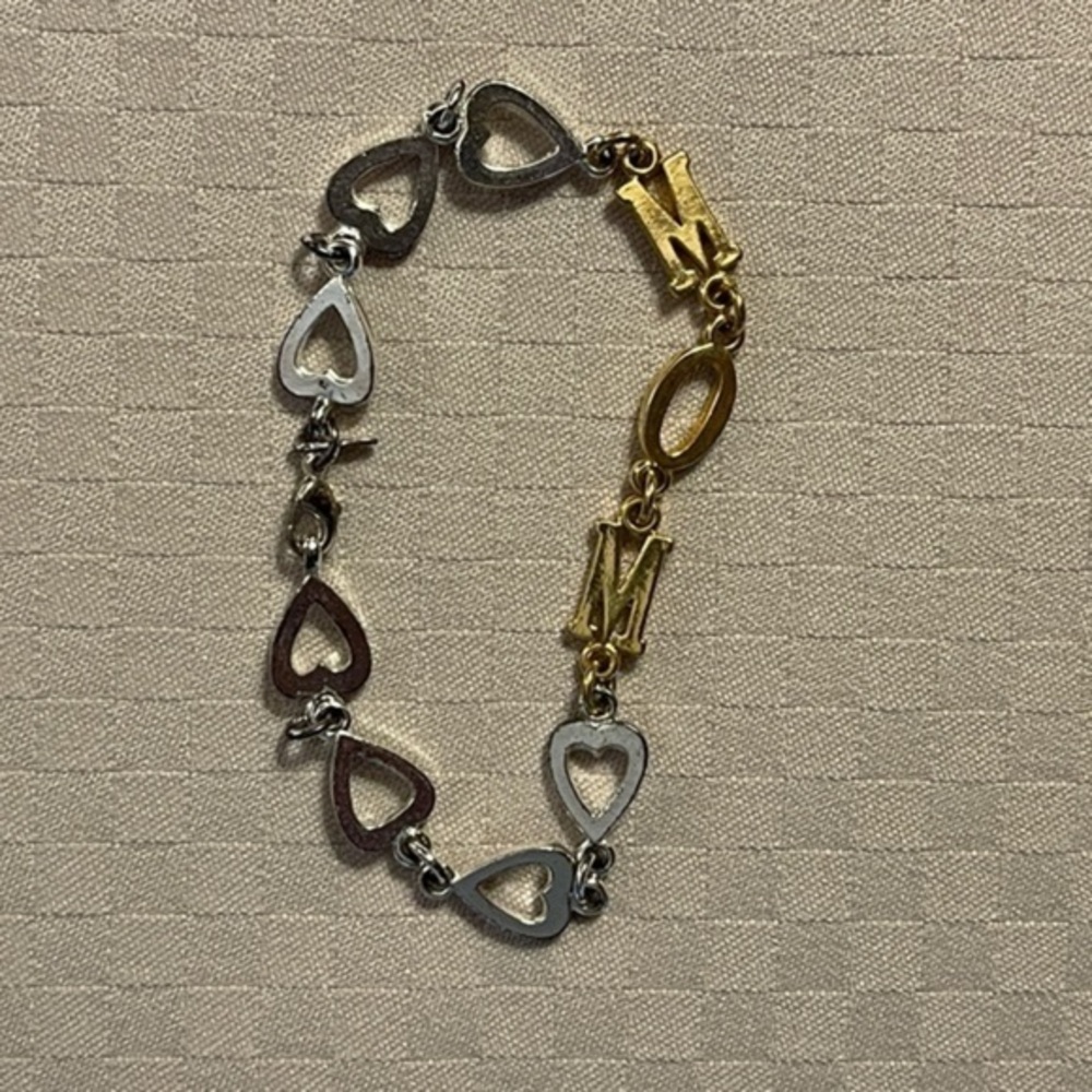 Avon vintage 7.5” silver tone & gold tone MOM bracelet with heart links.